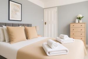 Ένα ή περισσότερα κρεβάτια σε δωμάτιο στο Elegant & Modern Flat in Wimbledon