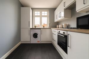 Η κουζίνα ή μικρή κουζίνα στο Elegant & Modern Flat in Wimbledon