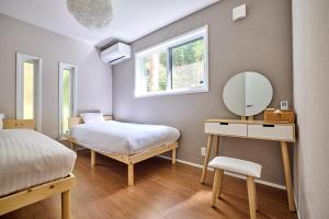 Postel nebo postele na pokoji v ubytování ヘルシンキ