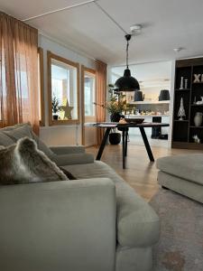 a living room with a couch and a table at Villa Älva i Sälen in Sälen