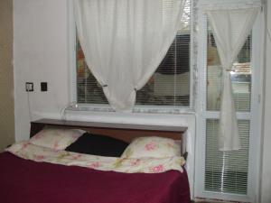 Ένα ή περισσότερα κρεβάτια σε δωμάτιο στο Daneto Apartment