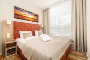 Кровать или кровати в номере Your Holidays Bel Mare Aqua 537F