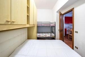 Giường trong phòng chung tại Residence Sole - Ponte di Legno & Parco Adamello
