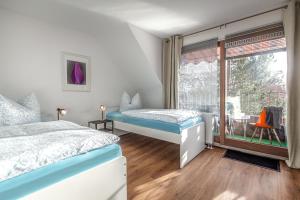 En eller flere senge i et værelse på Appartment Haus Rothenhaus Hamburg