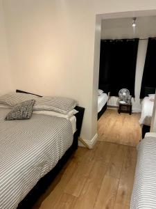 Ένα ή περισσότερα κρεβάτια σε δωμάτιο στο The Aura