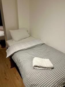 Ένα ή περισσότερα κρεβάτια σε δωμάτιο στο The Aura