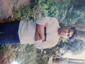 达卡Suite Property Insurance Group Of Company的一名身穿白衬衫的男子正在看着镜头