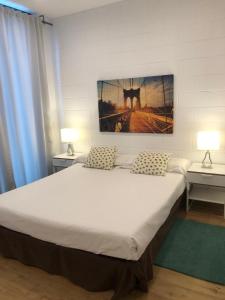 Ένα ή περισσότερα κρεβάτια σε δωμάτιο στο Apartamento de 70 m2 en el Arroyo de la Vega , Alcobendas