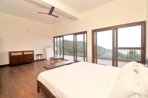 Ένα ή περισσότερα κρεβάτια σε δωμάτιο στο Villa Cirrus