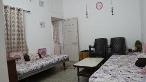 Ένα ή περισσότερα κρεβάτια σε δωμάτιο στο Perfect Home by mQube