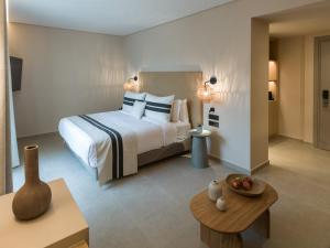 Ένα ή περισσότερα κρεβάτια σε δωμάτιο στο Heromylos Resort And Spa +44 φωτογραφίες