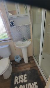 Et badeværelse på Ollie's Towyn