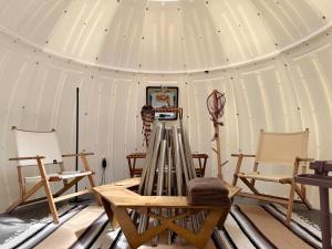 a room with a tent with chairs and a table at Kuruma Asobi Adventure Field Appi - Camp - Vacation STAY 42095v in Hachimantai