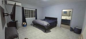 Ένα ή περισσότερα κρεβάτια σε δωμάτιο στο Your Dream Beachfront Escape Luxury, Nature, Fun at Juan Hombron