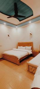 Postel nebo postele na pokoji v ubytování Morbex Inn Hotel Islamabad