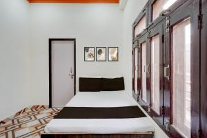 Postel nebo postele na pokoji v ubytování Hotel O Kv Building