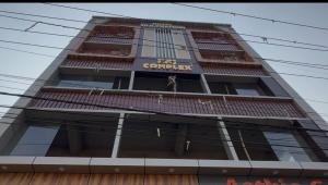 a building with a sign on the side of it at Hotel O Silk Premium in Khagaul