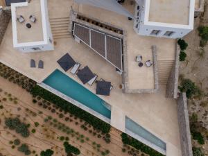 an overhead view of a building with a pool at Aegean Hestia Luxury Villa of Paros in Kampos Paros
