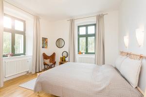 Ένα ή περισσότερα κρεβάτια σε δωμάτιο στο Alte Försterei Wildenthal