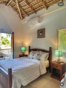 Ένα ή περισσότερα κρεβάτια σε δωμάτιο στο VillasMana PlayaBonita LasTerrenas NearBeach