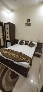 En eller flere senge i et værelse på Hotel Sunshine