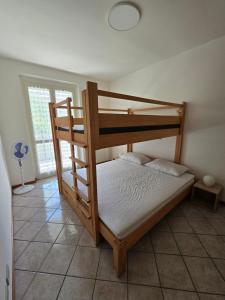 Ένα ή περισσότερα κρεβάτια σε δωμάτιο στο Appartamento tranquillo a 300m dal mare