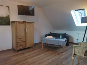 a living room with a couch and a table at Bleckmanns Hof in Werne an der Lippe