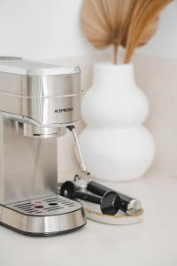 a mixer sitting on a counter next to a lamp at Private 1 bedroom villa with rooftop and pool in Tumbak Bayuh
