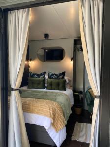 Ένα ή περισσότερα κρεβάτια σε δωμάτιο στο Stacey's Mini Hideaway