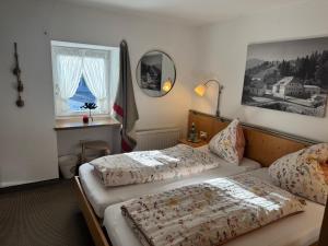 Postel nebo postele na pokoji v ubytování Ferienwohnung Saunahaus