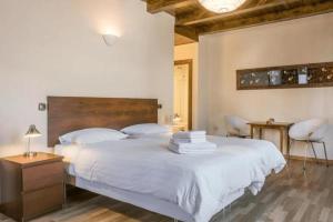 Ένα ή περισσότερα κρεβάτια σε δωμάτιο στο Hotel Nau Iori