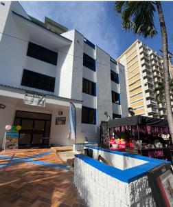 a building with a tent in front of it at Queens Hostel Waikiki in Honolulu