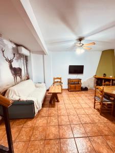 a bedroom with a bed with a deer on the wall at La Osera in Arroyo Frio