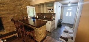 a kitchen with a counter and a brick wall at Svinista vilage in Kičevo