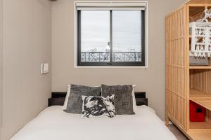 Ένα ή περισσότερα κρεβάτια σε δωμάτιο στο Mi-HOTEL SHIMOKITAZAWA