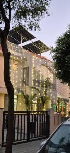 a building with christmas lights on the side of it at The Palm Villa in Jaipur