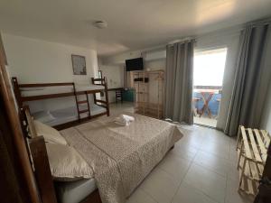 Ένα ή περισσότερα κρεβάτια σε δωμάτιο στο Pousada Mar Aberto