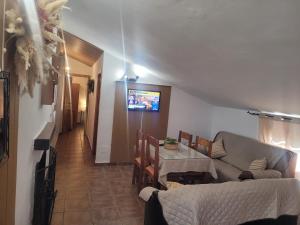 a living room with a couch and a table at Casa de la Luz in Cuevas del Campo