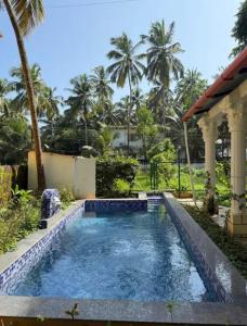 Πισίνα στο ή κοντά στο Kiki Stay- 2BHK Apartment with Pool