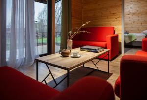 a living room with a red couch and a coffee table at Meronts in Yeghipatrush