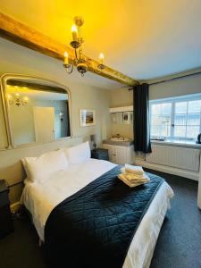 Postel nebo postele na pokoji v ubytování The Ilchester Arms + 3 fotografie