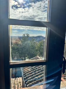 a view from a window looking out at the sky at Il Borgo Del Lupo Relax Family Apartments in Tuscany with Restaurant & Swimming Pool in Sarteano