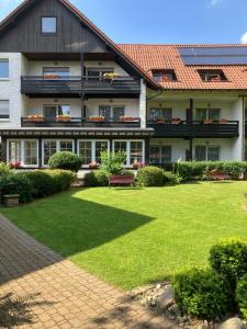 a large building with a lawn in front of it at The Resting Place in Lemgo