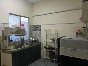 Kuchyň nebo kuchyňský kout v ubytování D' Farm Homestay