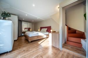 En eller flere senge i et værelse på Chalon Hacienda