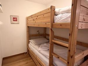 a couple of bunk beds in a room at Chesa Silvretta - Celerina in Celerina