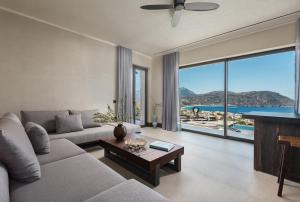 a living room with a couch and a table at Omega Residences in Karpathos