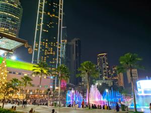 a city skyline at night with a fountain at Sky Suites KLCC Kuala Lumpur LB in Kuala Lumpur