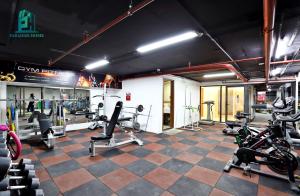 a gym with several treadmills and machines in a room at Duc Hoang Residence & Hotel West Lake in Hanoi
