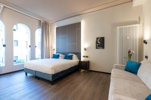 En eller flere senge i et værelse på AH - Collezione Brera